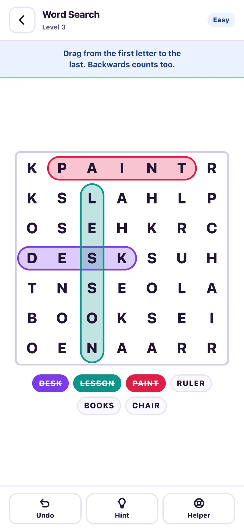 A word search grid with DESK, LESSON and PAINT circled in purple, green and red, and the same words struck through in the word list below.